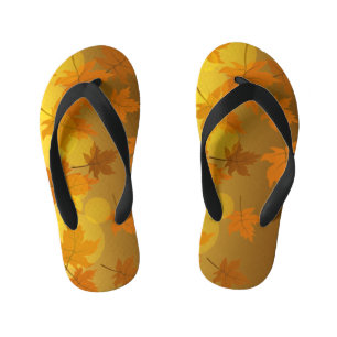 Autumn pattern with falling maple leaves and bokeh kid's jandals