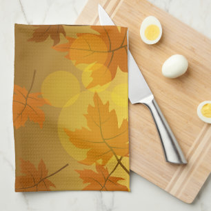 Autumn pattern with falling maple leaves and bokeh tea towel