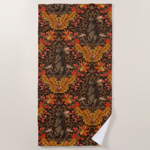 Autumn rabbit on brown beach towel