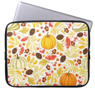 Autumn seamless background with pumpkins, acorns,  laptop sleeve