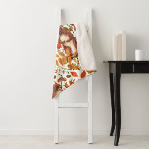 Autumn squirrels and autumnal flora on off white sherpa blanket