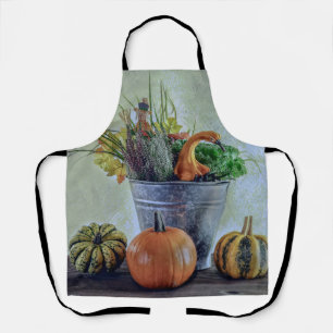 Autumn still life with pumpkins, flowers apron