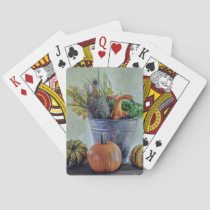 Autumn still life with pumpkins, flowers  playing cards
