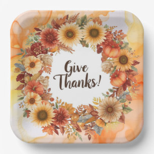 Autumn themed thanksgiving with flowers pumpkins paper plate