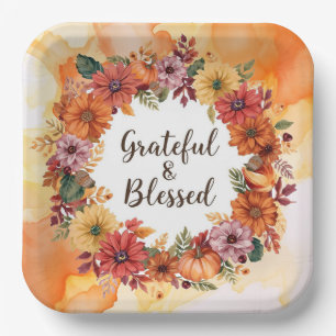 Autumn themed thanksgiving with flowers pumpkins paper plate