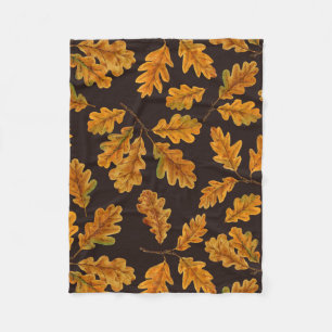 Autumnal oak leaves on dark brown fleece blanket