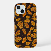 Autumnal oak leaves on dark brown