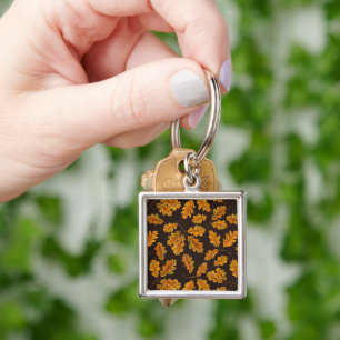 Autumnal oak leaves on dark brown key ring