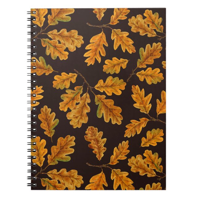 Autumnal oak leaves on dark brown notebook (Front)
