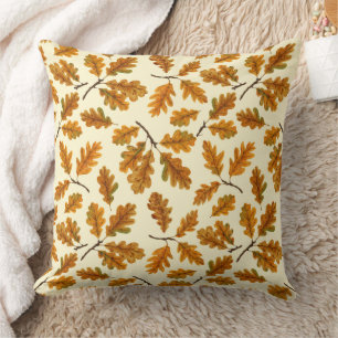 Autumnal oak leaves on off white cushion