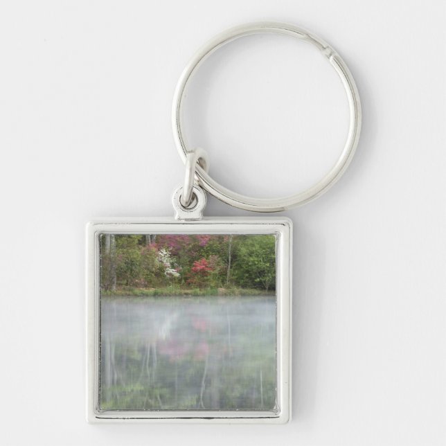 Azaleas relfecting in a pond during early key ring (Front)
