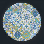 Azulejo tiles in blue and yellow paper plate<br><div class="desc">A patchwork of hand‑painted azulejo‑inspired tiles</div>