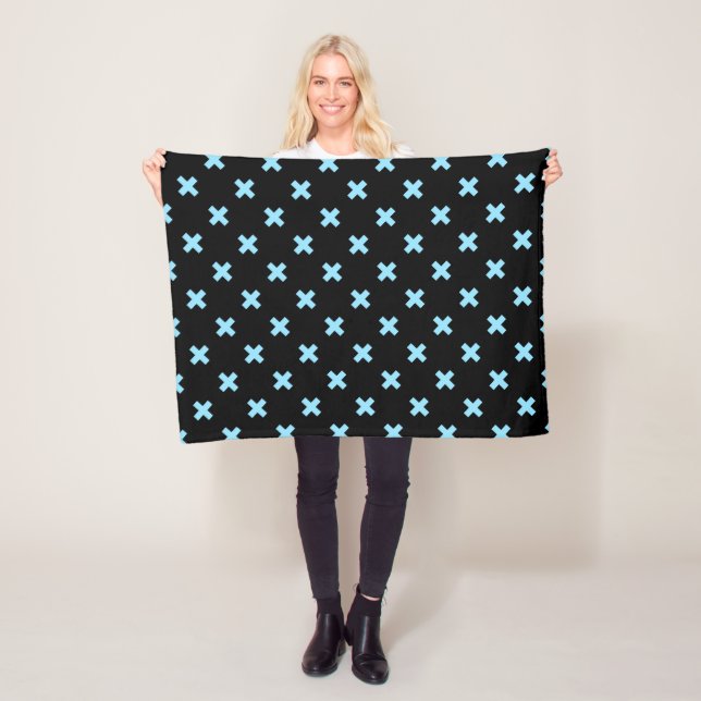 Baby blue cross stitches on black fleece blanket (In Situ)