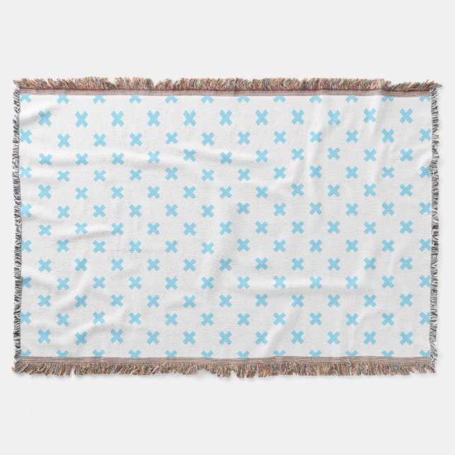 Baby blue cross stitches on white throw blanket (Front)