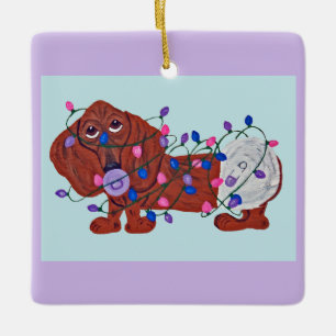 Baby Dachshund Tangled In Christmas Lights Ceramic Ornament