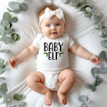 Baby Elf Family Christmas Baby Bodysuit<br><div class="desc">This adorable baby elf bodysuit is the perfect way to celebrate Christmas with your little one! Featuring a cute elf design and a festive holiday message, this bodysuit is sure to bring smiles all around. Made from soft and comfortable materials, it's perfect for family photos, holiday gatherings, or just everyday...</div>