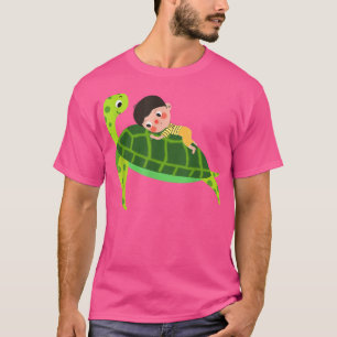 Baby lying on the shell of a lovely green turtle  T-Shirt