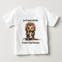 Baby Prehesile-Tailed Porcupine holding pencil