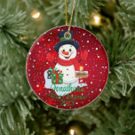 Baby's First Christmas cute snowman black hat  Ceramic Tree Decoration<br><div class="desc">A whimsical Christmas tree ornament featuring an adorable snowman surrounded by delicate snowflakes. Customise it with your child's name and the year for a personalised touch that captures the joy of the season.
Use the "Personalise" button to customise to your liking.</div>