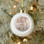 Baby's First Christmas Holiday Ceramic Ball Christmas Ornament<br><div class="desc">This charming baby's first Christmas holiday ceramic ball ornament features your baby's photo, name or any other message and BLESSED on the front (can be deleted.) PHOTO TIP: Crop your high resolution photo into a square as you want it to appear on the ornament BEFORE you upload it. CHANGE the...</div>