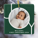 Baby's First Christmas Photo Keepsake Green Ceramic Ornament<br><div class="desc">This stylish Baby's First Christmas Photo Ornament is decorated with the word JOY in modern typography on a pine green background.
Easily customisable with your photo,  name,  and year.
Makes a special gift for grandparents,  aunts,  and uncles.</div>