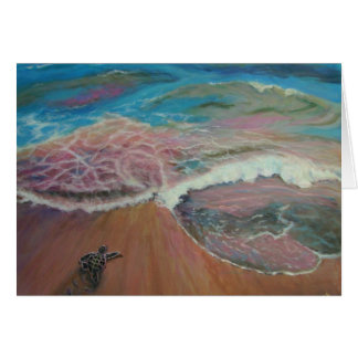 babyturtle on shore heading to ocean