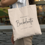 Bachelorette | Modern Minimalist Script Bridesmaid Tote Bag<br><div class="desc">This Bachelorette Party custom design features a handwritten script typography. You can easily personalise the bride-to-be's name,  date,  bridemaid's name or your custom message! The perfect elegant accessory for a bachelorette party or bachelorette weekend!</div>
