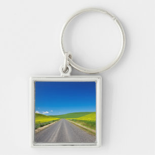 Backcountry road through Spring Canola Fields Key Ring