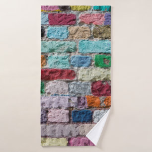 Background of painted colour brick wall texture bath towel
