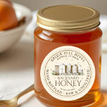 Backyard Hives Honey Label Hand Bottled Raw<br><div class="desc">Put your bees front and centre by choosing this beautiful rendition of a backyard hive. This label exudes all the characteristics of a picturesque family business, while still maintaining a strong level of sophistication with a professional touch. Simply personalise with your apiary name, address and honey description (raw, hand bottled,...</div>
