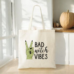 Bad Witch Vibes Modern Halloween Tote Bag<br><div class="desc">Carry your essentials in style with our Bad Witch Vibes Modern Halloween Tote Bag! Featuring a sleek black design with the bold phrase "Bad Witch Vibes" in modern typography, this tote is perfect for adding a touch of spooky flair to your daily routine. Made from durable, high-quality materials, it's both...</div>