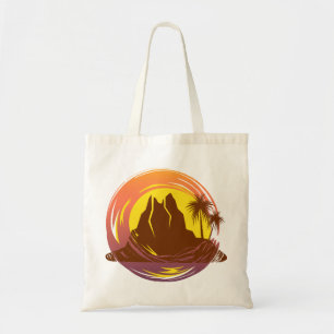 Badge with tropical volcano scenery and palm trees tote bag