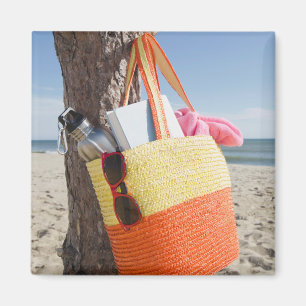 Bag Hanging On Tree Trunk At Sandy Beach Magnet