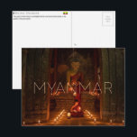 Bagan, Myanmar Travel Postcard<br><div class="desc">Send this beautiful postcard to your loved ones featuring two young monks study by candlelight before a serene Buddha statue in the golden-lit Ananda temple.</div>