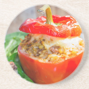 Baked stuffed peppers with meat sauce and cheese coaster