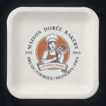 Bakery Store Pastry Chef Dessert Sweets Cake Baker Paper Plate<br><div class="desc">This vintage-style circular logo features a cheerful female pastry chef wearing a traditional white chef's hat and apron. She is framed by a warm orange circular backdrop and holds a wire whisk in one hand and a flaky croissant in the other, symbolizing her culinary expertise. Below her, a blank, elegant...</div>