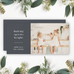 Baking Spirits Bright | Modern Stylish Kids Photo Holiday Card<br><div class="desc">Stylish modern holiday baking photo flat greeting card with a classic typography quote "baking spirits bright" with a dividing line and family name in white. The design features a bluish black charcoal grey colour. The photo, greeting and name can be easily customised for a design as unique as your special...</div>