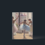Balconies in front of the window postcard<br><div class="desc">Young Paris Opera dancers in a rehearsal room opposite a window where spring sun bathes the room and pastel-colored tous couscous,  reflecting a soft,  tender and bright light.</div>