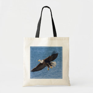 Bald eagle in flight tote bag