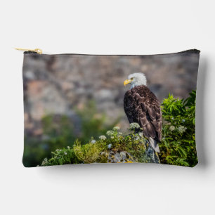 Bald eagle sitting on the rock accessory pouch