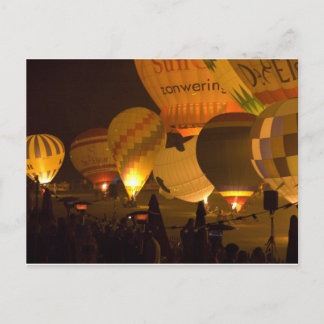 Balloons glowing in the dark postcard