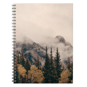 Banff national park foggy mountains and forest in notebook