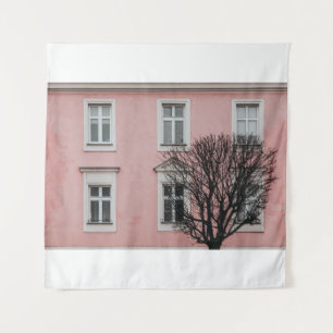 BARE TREE IN FRONT OF PINK BUILDING TAPESTRY