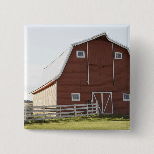 Barn in rural landscape 15 cm square badge