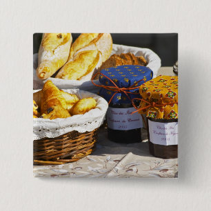 Basket with croissants and chocolate breads. 15 cm square badge