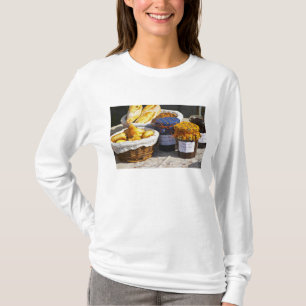 Basket with croissants and chocolate breads. T-Shirt