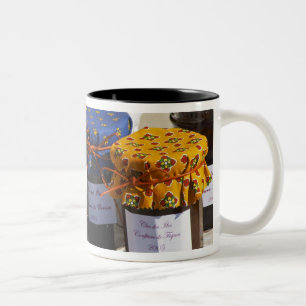 Basket with croissants and chocolate breads. Two-Tone coffee mug