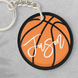 Basketball black orange custom name key ring<br><div class="desc">Keychain featuring a basketball in black and orange and your name in white. All colours are customisable in the design tool.</div>