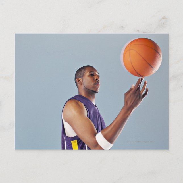 Basketball player balancing ball on one finger postcard (Front)