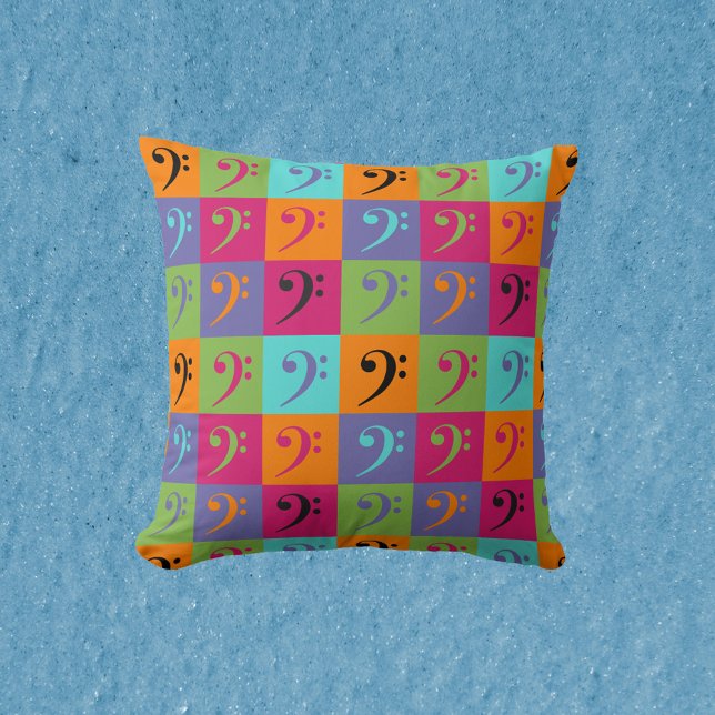 Bass Clef Musical Pattern Orange Pink Purple Cushion (A pillow with a fun and colorful bass clef pattern.)
